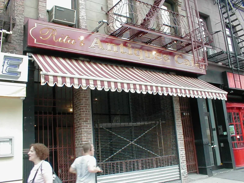 metal signage and black business awnings olympic pita