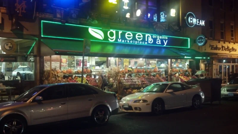 metal signage and black business awnings olympic pita