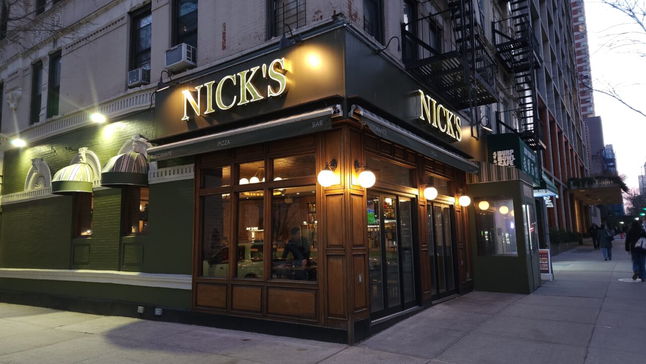 metal signage and black business awnings olympic pita